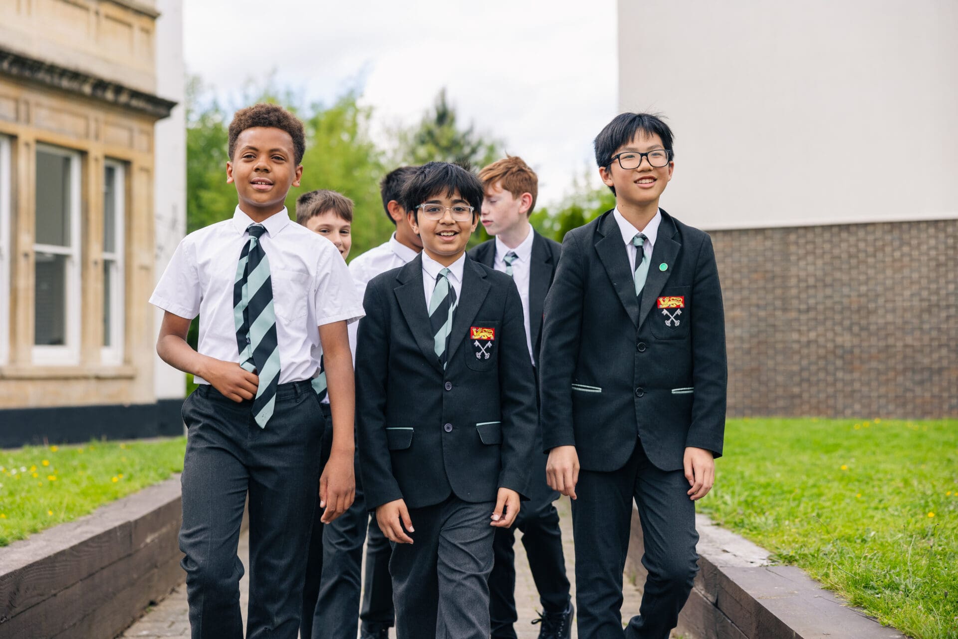 Image of a group of pupils walking through the quad in uniform