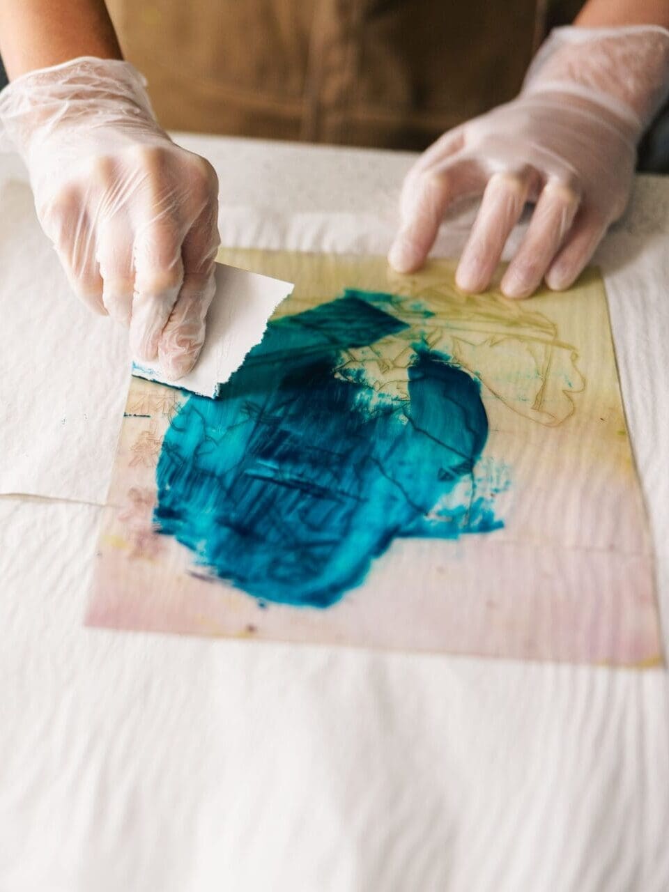 Image of pupils hands creating piece of art