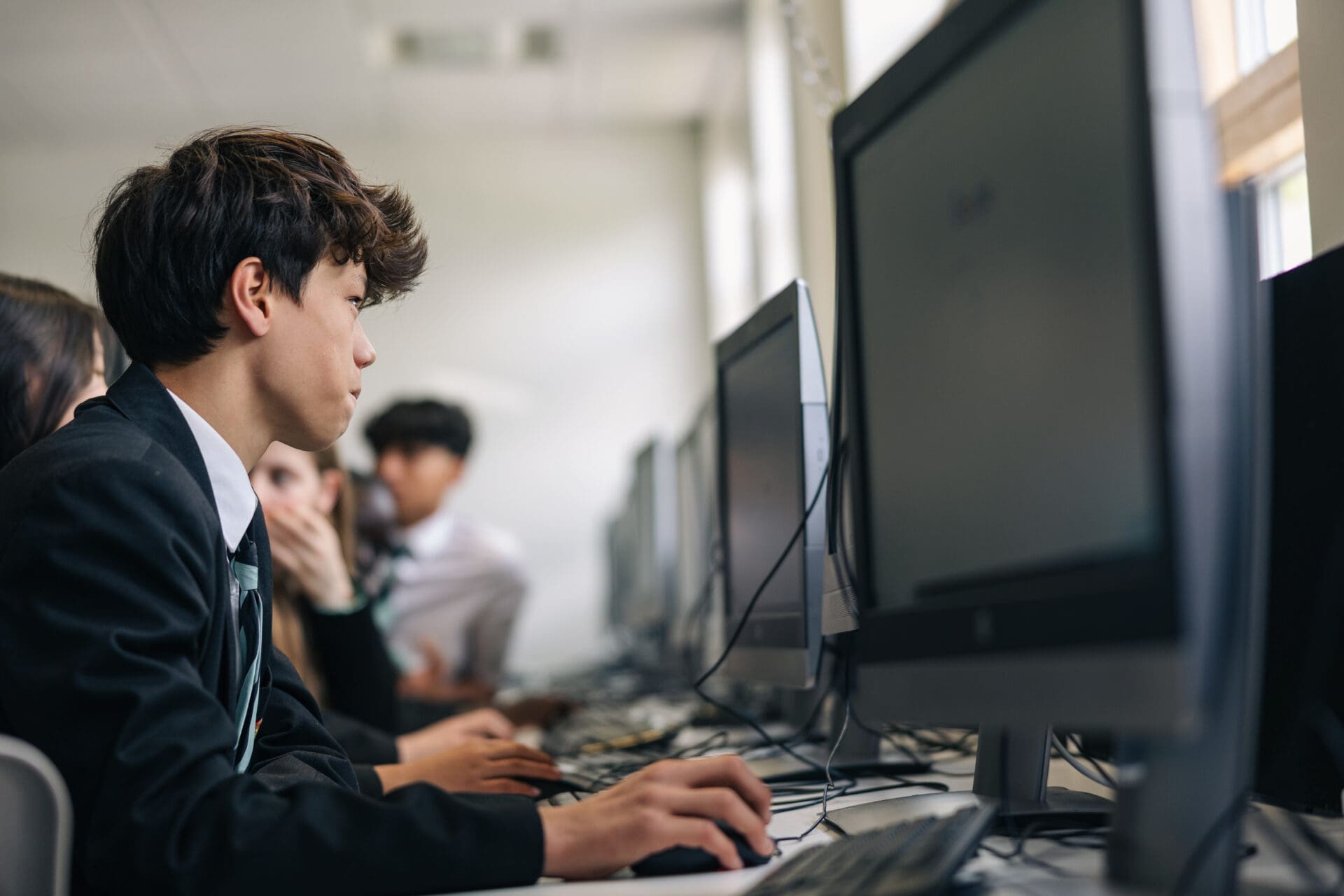 Image of a pupil working at a computer screen in a computing lesson 