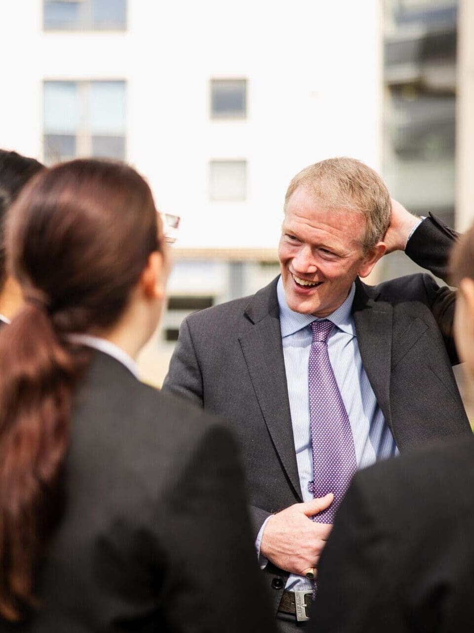 Image of the school head talking to some pupils