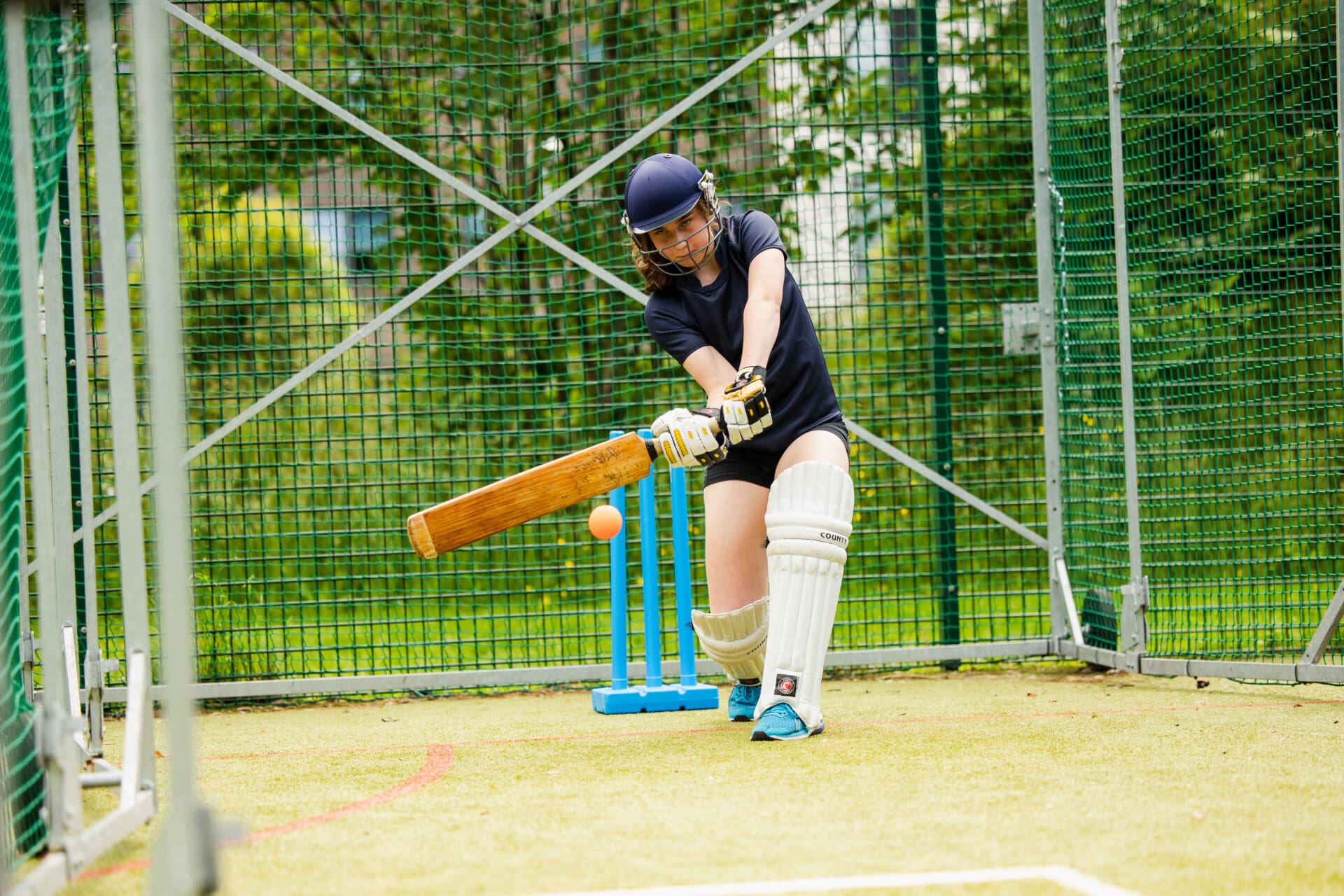 Image of a pupil playing cricket